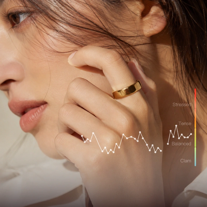 Woman wearing Ring Air with daily stress trend visualizations